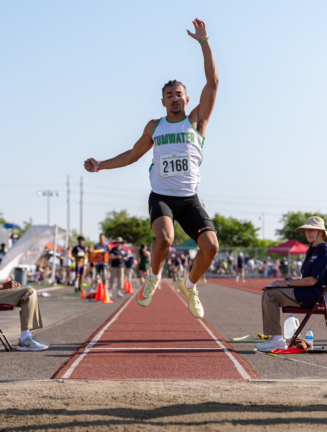 Tumwater’s Makhi Odoms leaps through the air during the first flight of the boys long jump at the WIAA 2A/3A/4A State Track and Field Championships on Thursday, May 25, 2023, at Mount Tahoma High School in Tacoma. (Joshua Hart/For The Chronicle)
